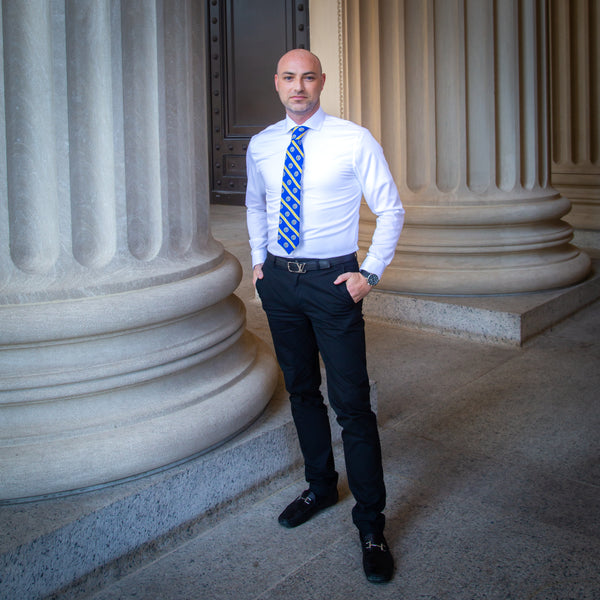 Blue pants top white shirt tie